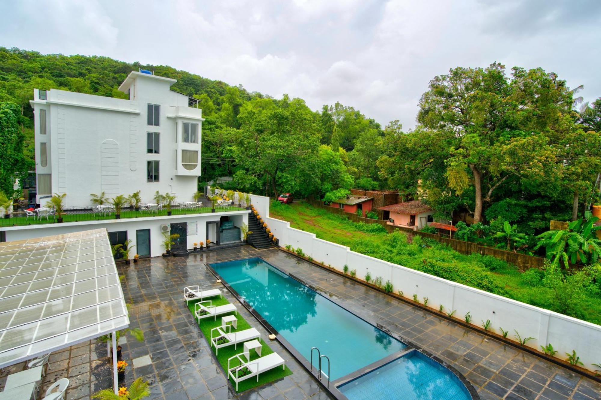Goa Courtyard By The Porto Arpora Hotel Baga Bagian luar foto