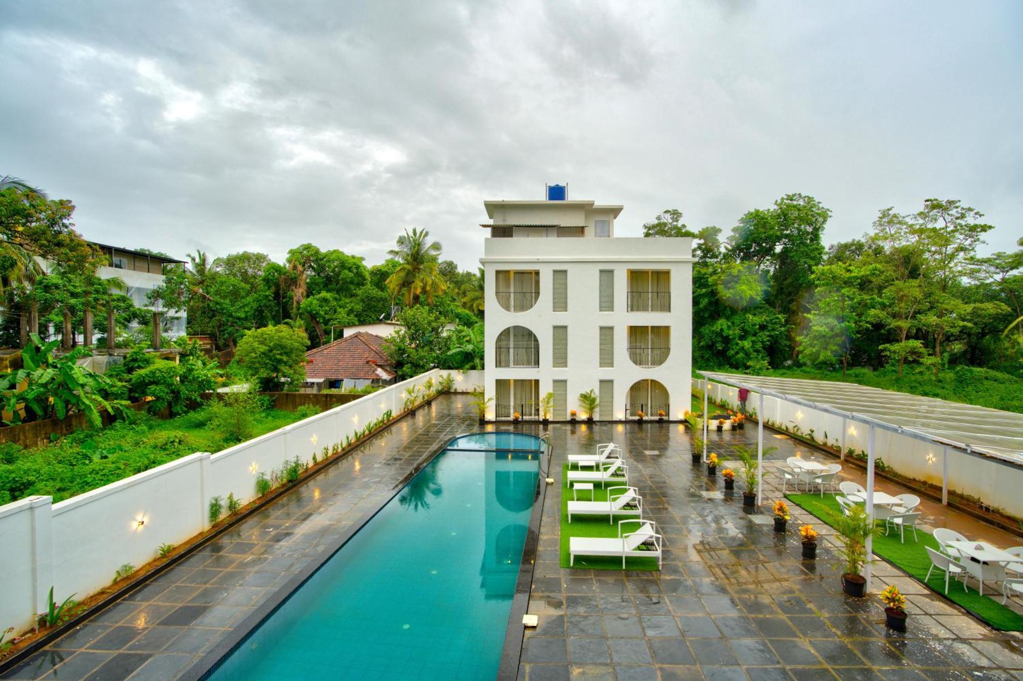 Goa Courtyard By The Porto Arpora Hotel Baga Bagian luar foto